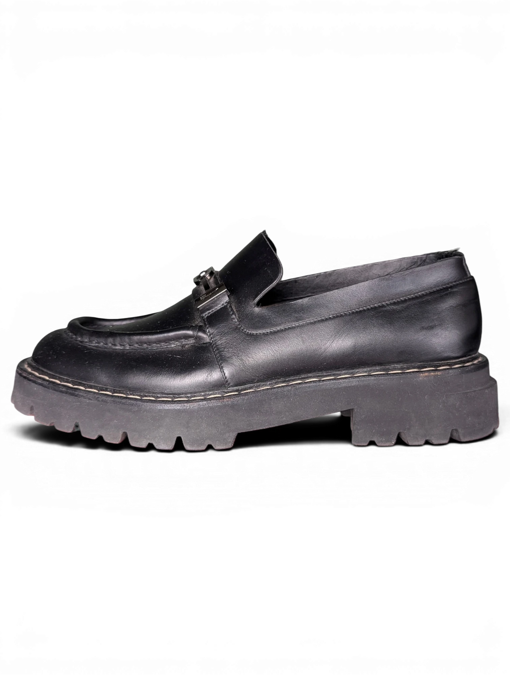 JAKE & IPI black leather Salvatore Ferragamo loafers with metal hardware and a chunky lug rubber sole