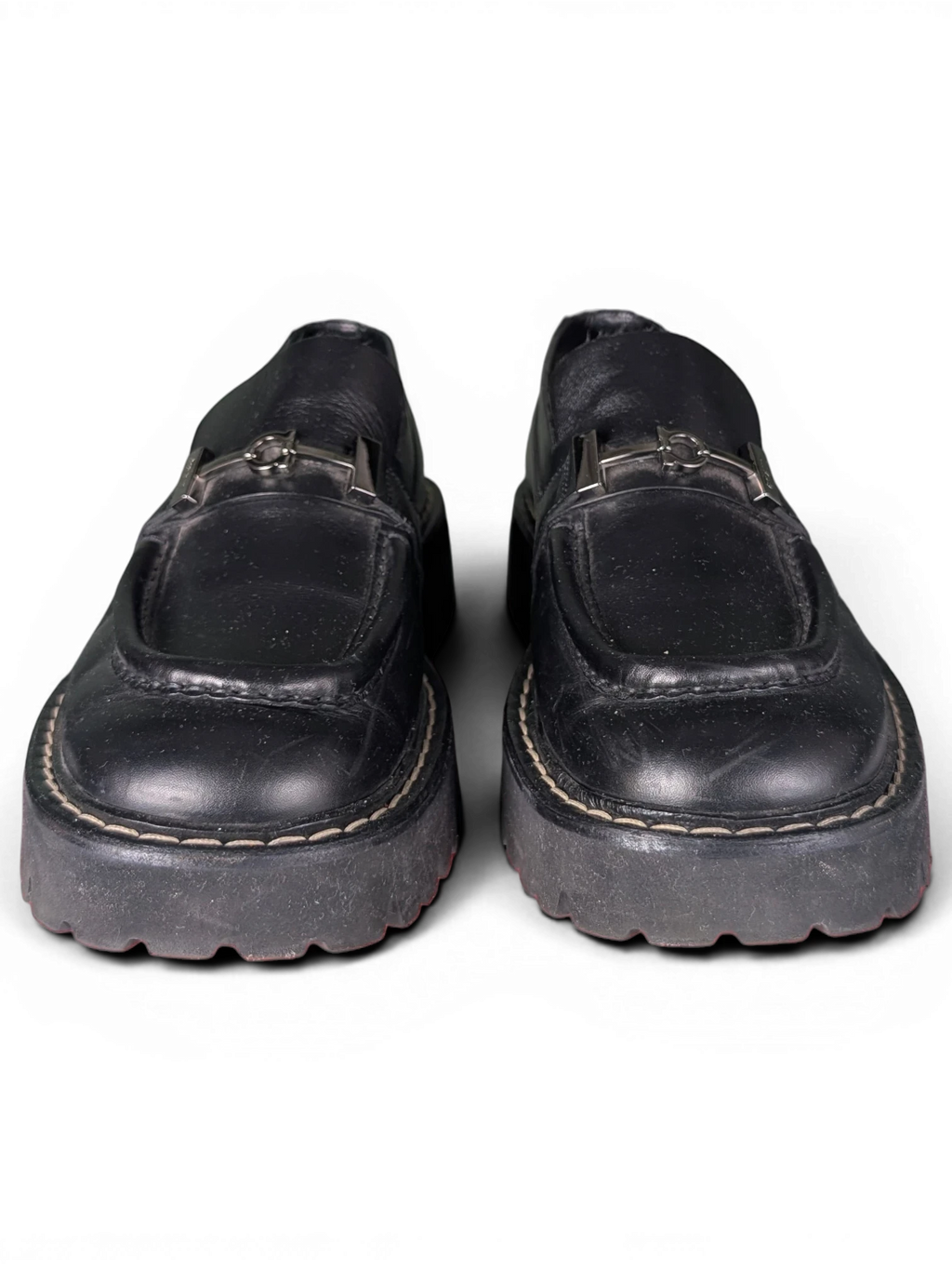 JAKE & IPI pre-owned black leather Salvatore Ferragamo loafers featuring silver metal hardware and chunky rubber soles.