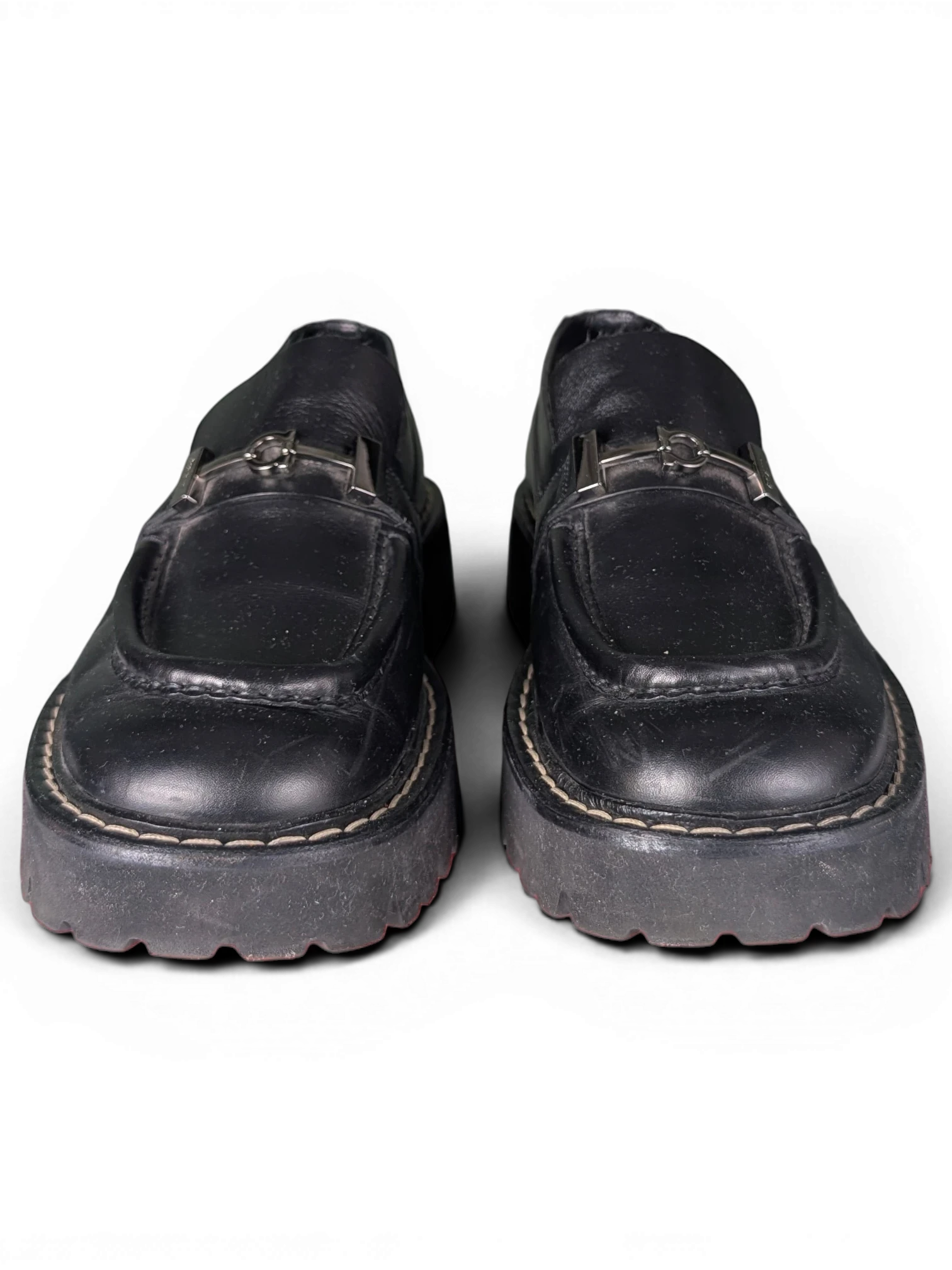 JAKE & IPI pre-owned black leather Salvatore Ferragamo loafers featuring silver metal hardware and chunky rubber soles.
