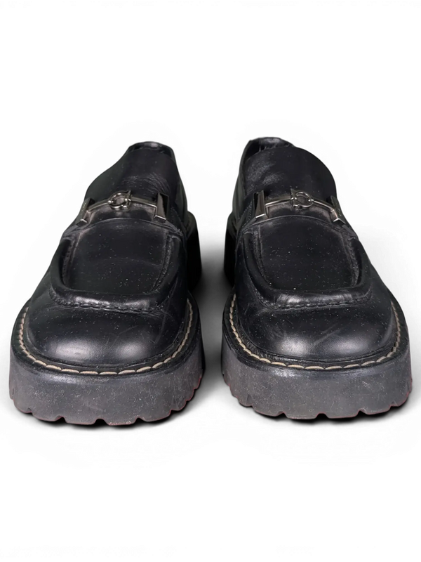 JAKE & IPI pre-owned black leather Salvatore Ferragamo loafers featuring silver metal hardware and chunky rubber soles.