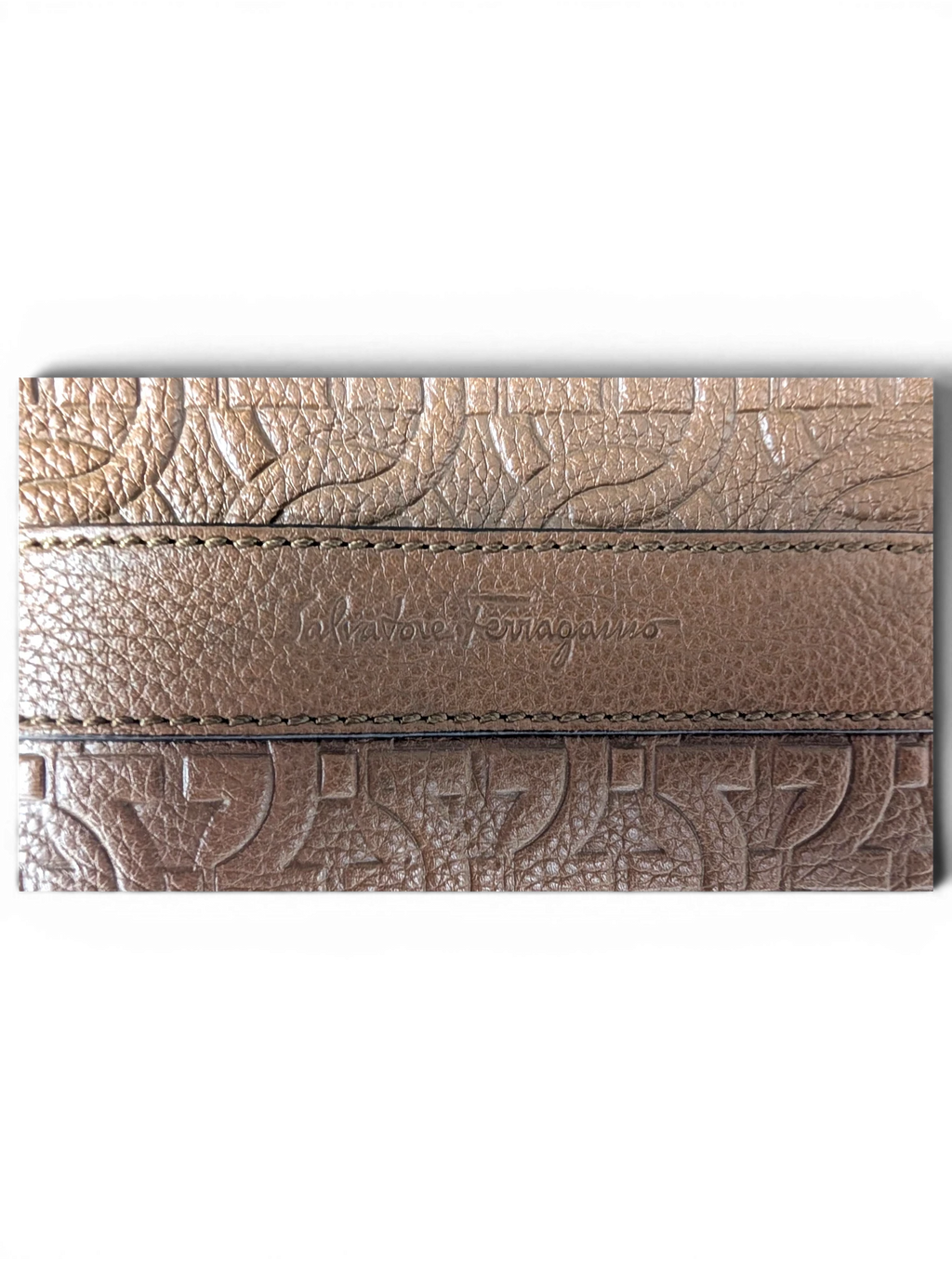 JAKE & IPI Salvatore Ferragamo brown leather messenger bag with embossed Gancini logo pattern and brand detail