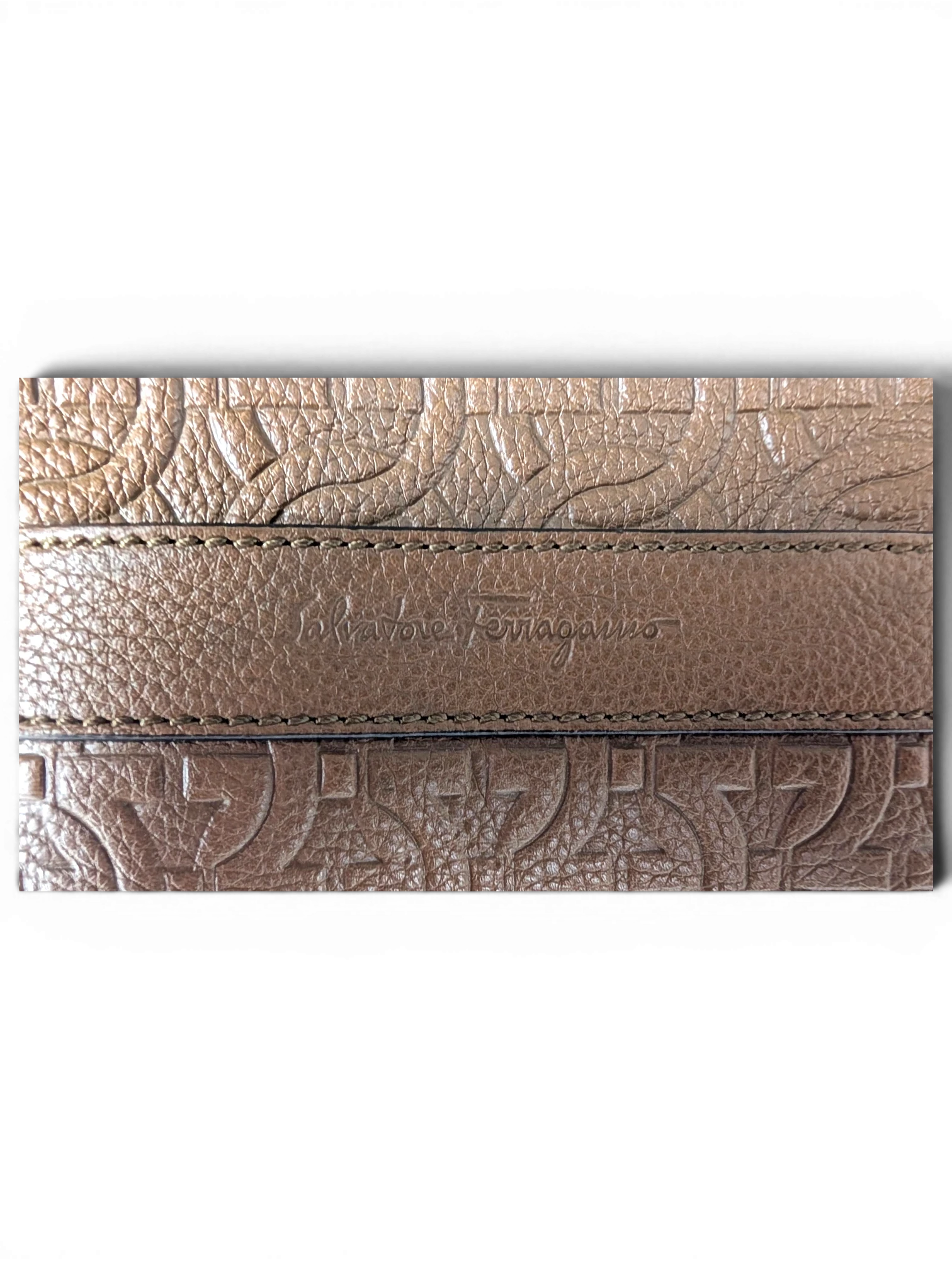 JAKE & IPI Salvatore Ferragamo brown leather messenger bag with embossed Gancini logo pattern and brand detail