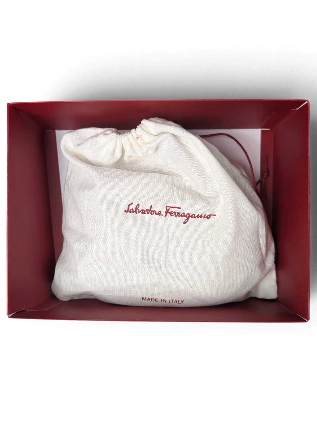JAKE & IPI Salvatore Ferragamo branded cream cotton drawstring dust bag inside a burgundy presentation box