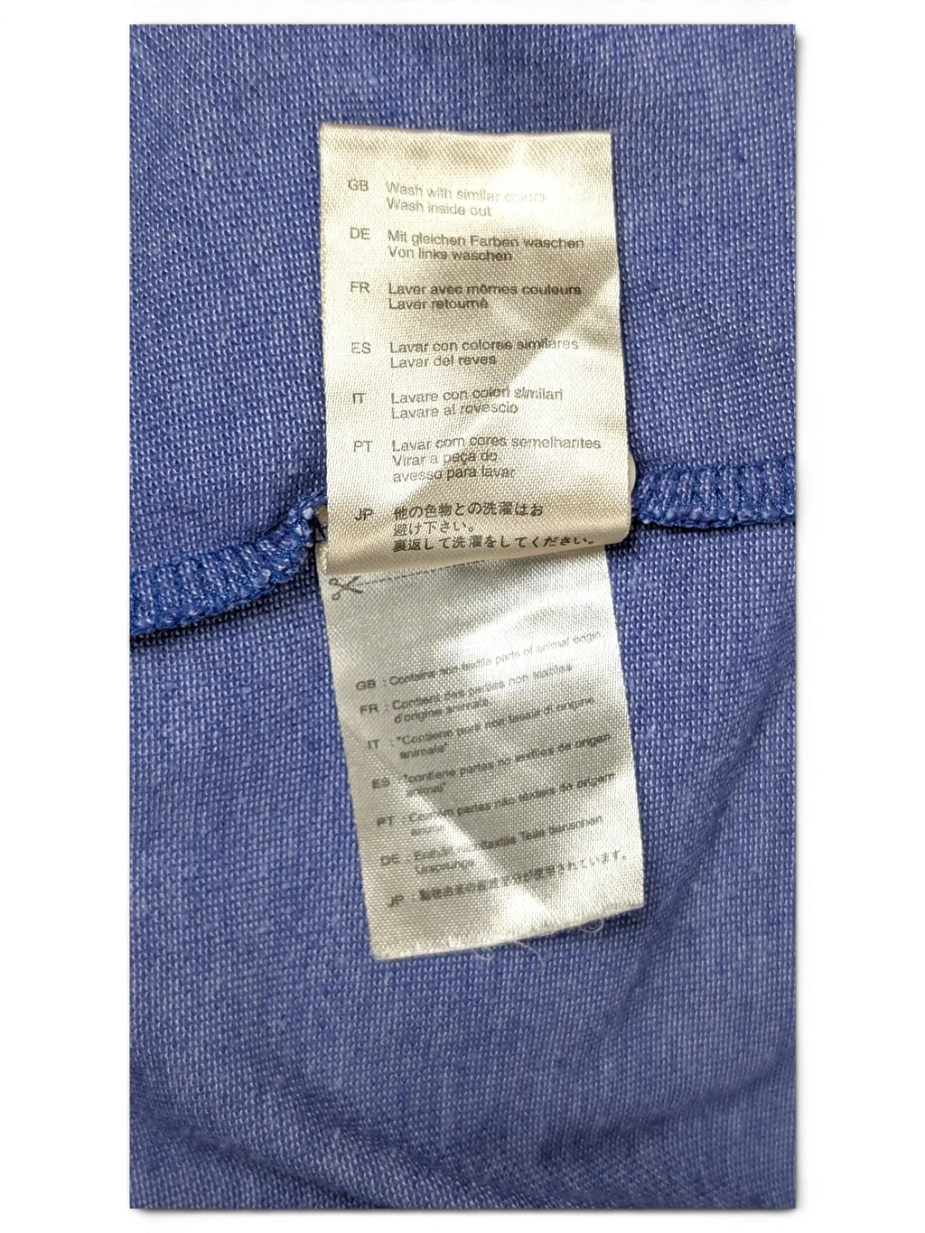 JAKE & IPI Scotch & Soda grey polo shirt care label with multi-language washing instructions