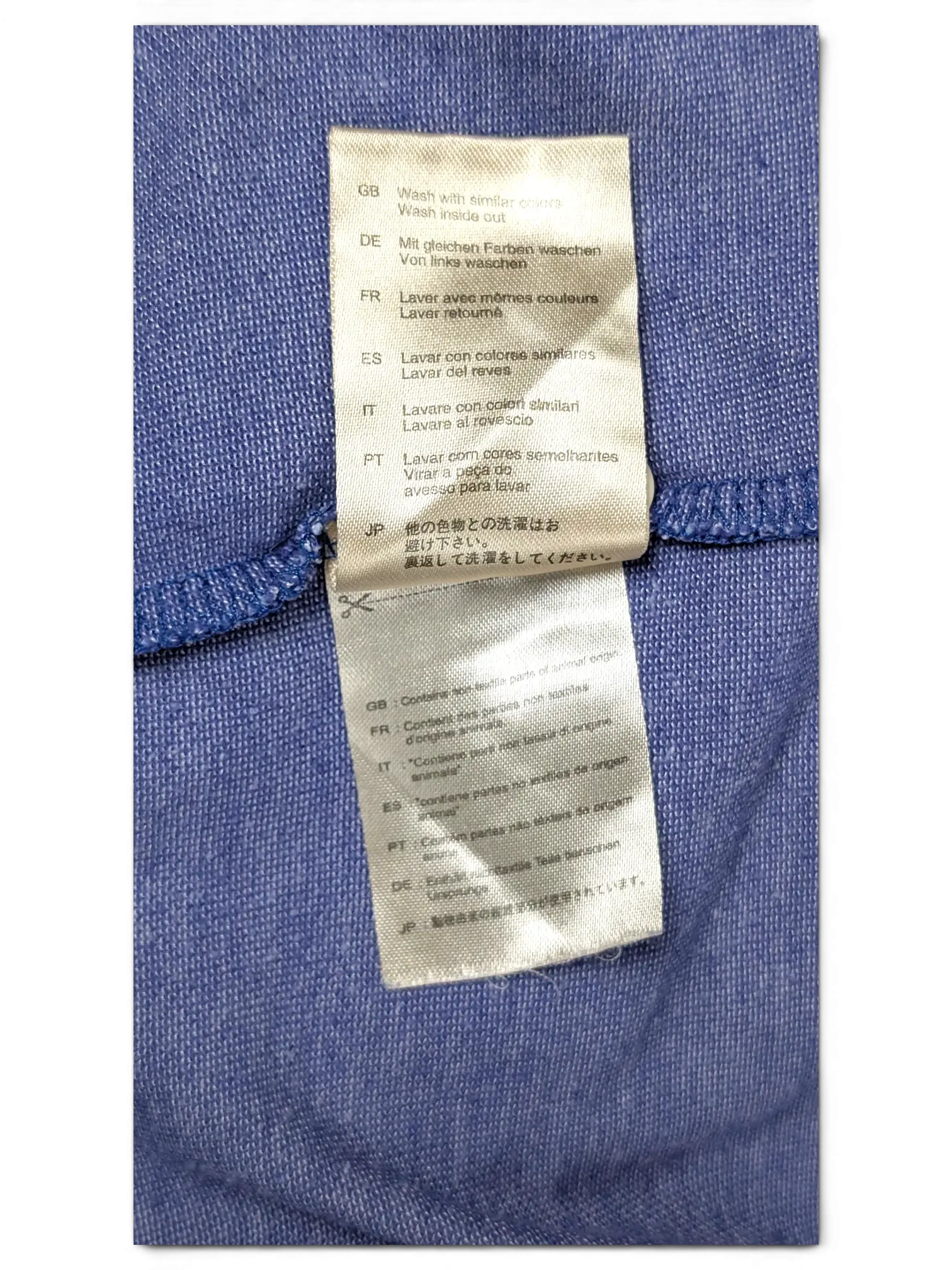 JAKE & IPI Scotch & Soda grey polo shirt care label with multi-language washing instructions