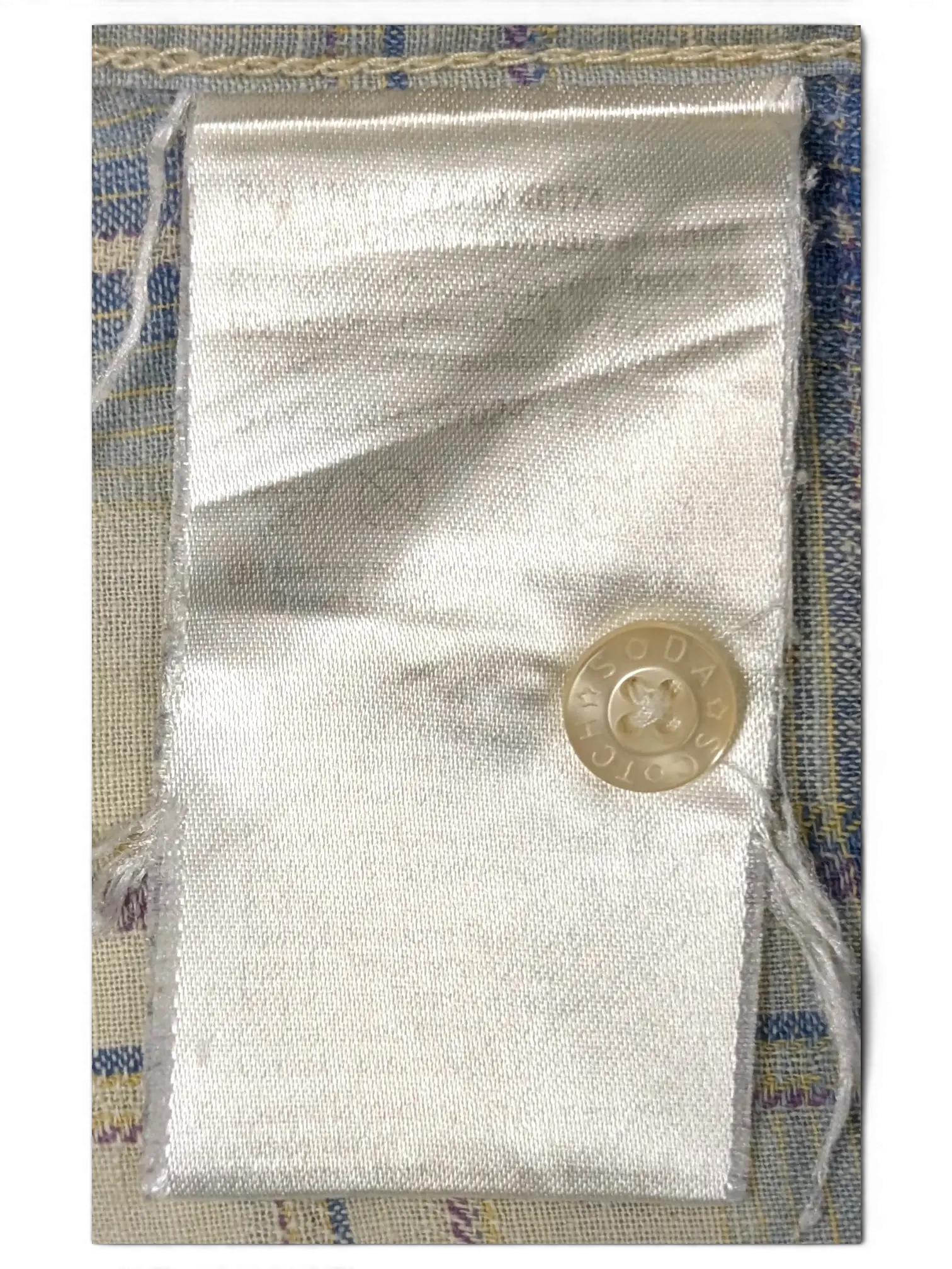 JAKE & IPI Scotch & Soda branded spare button and fabric swatch in a small white satin drawstring pouch