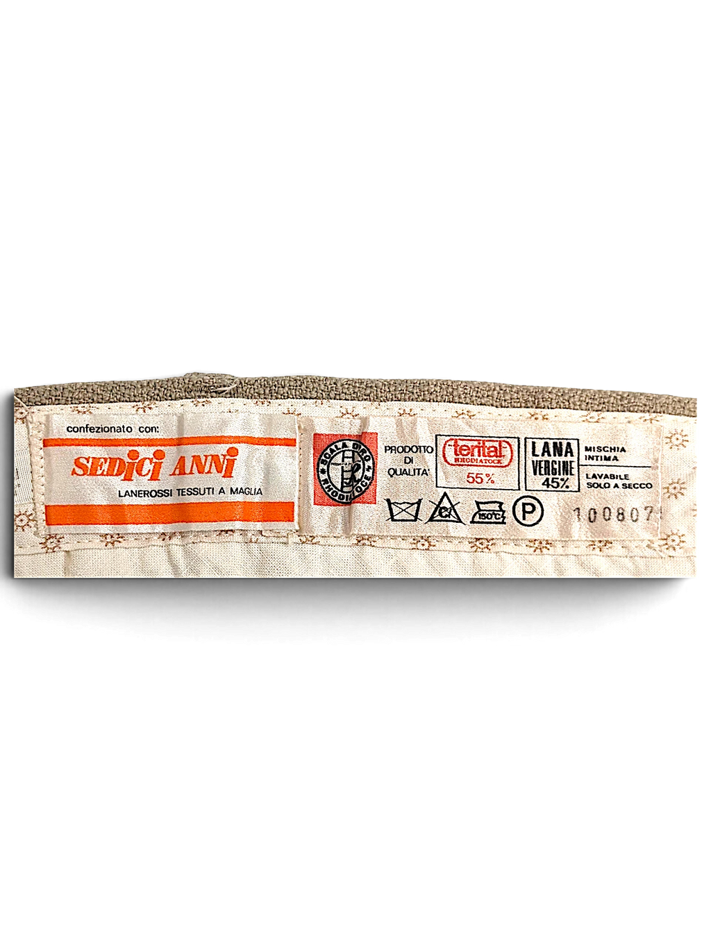 JAKE & IPI Sedici Anni beige wool-blend trousers interior garment label showing fabric composition and care symbols