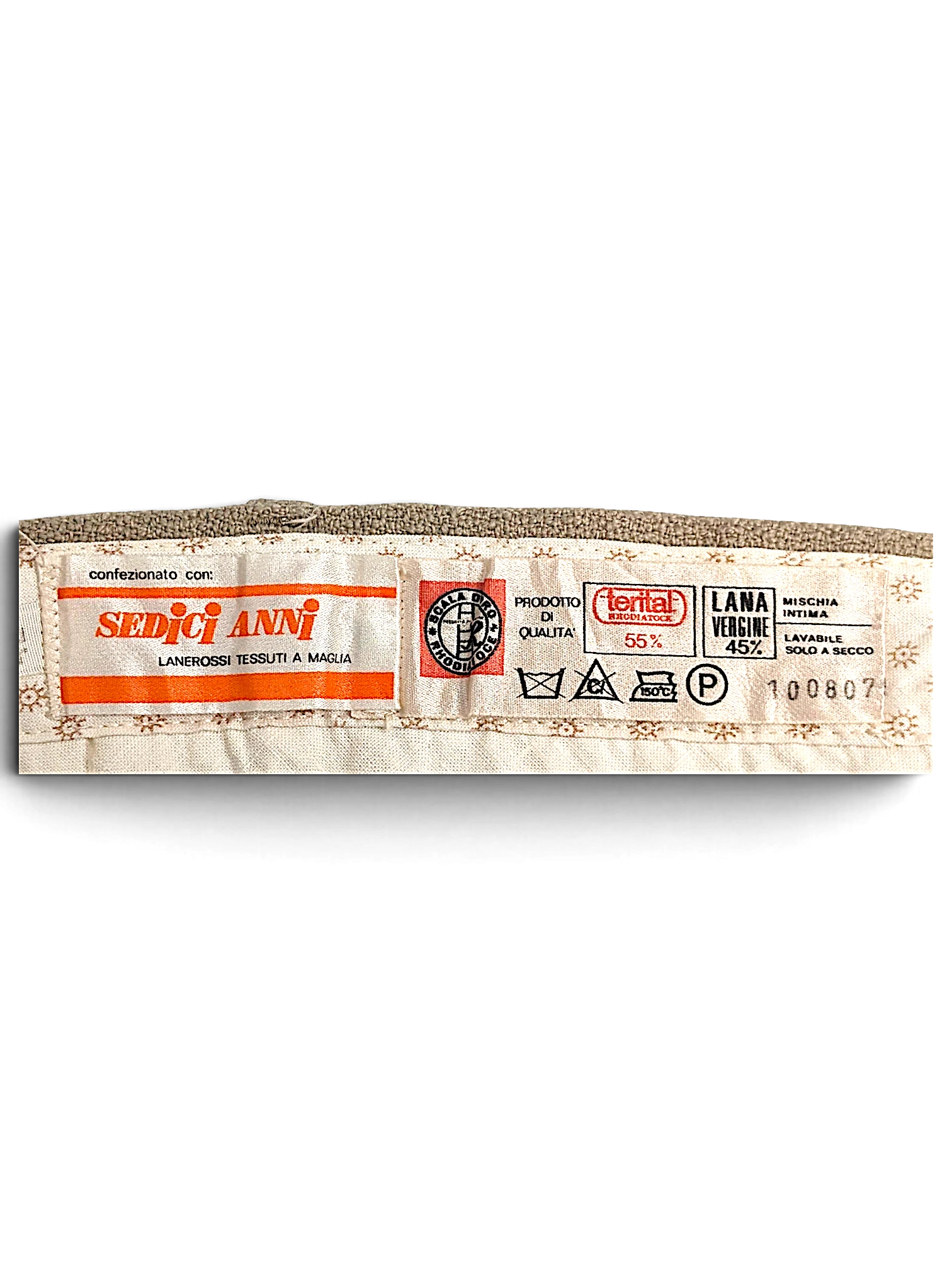 JAKE & IPI Sedici Anni beige wool-blend trousers interior garment label showing fabric composition and care symbols
