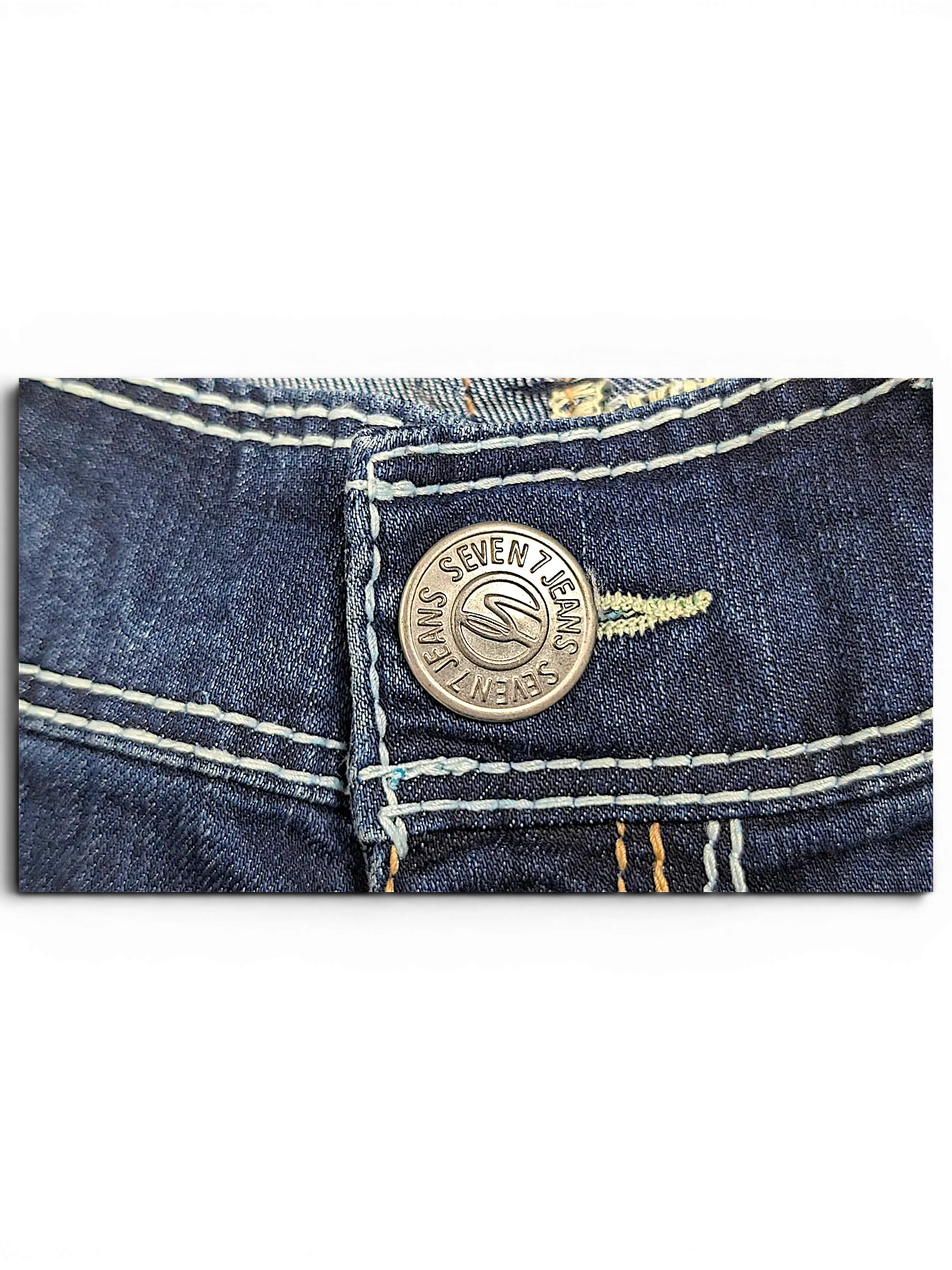 JAKE & IPI Seven7 capri jeans featuring a branded silver metal button and contrast stitching on dark blue denim