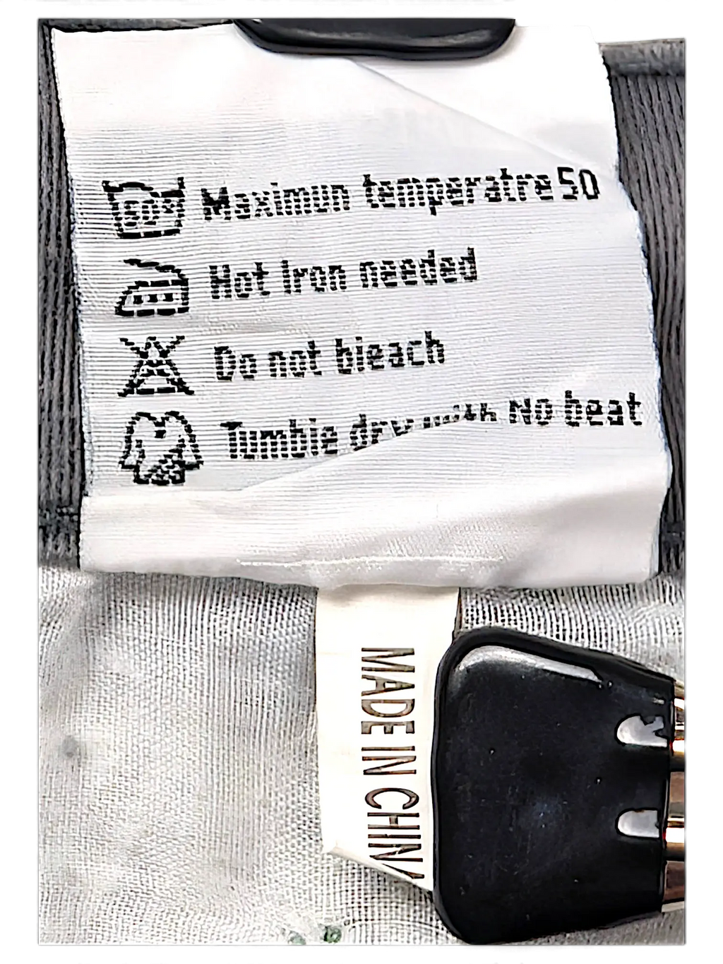 JAKE & IPI Seyoo Denim Division Y2K jeans care label with washing instructions and Made in China tag