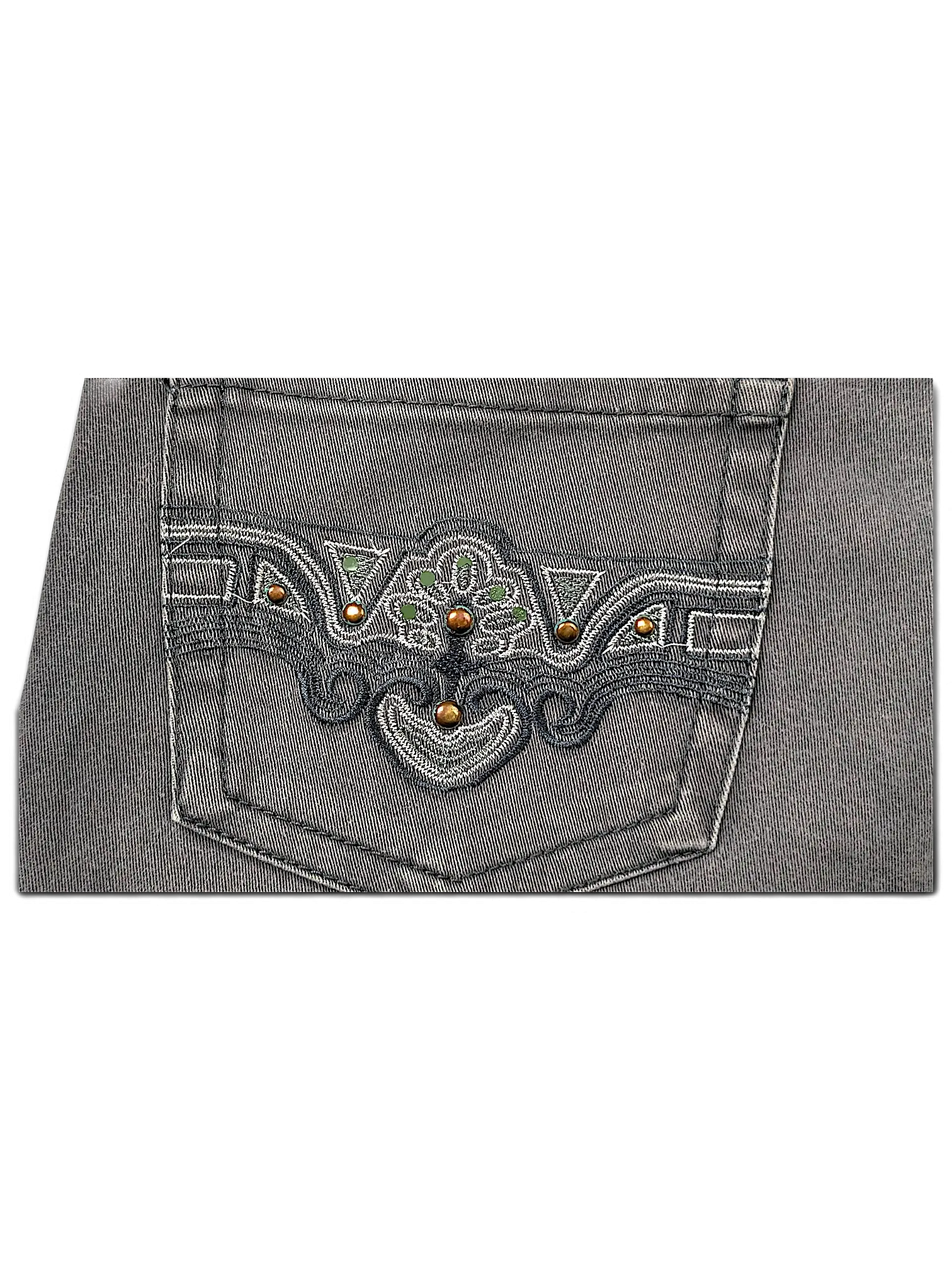JAKE & IPI Seyoo Denim Division Y2K jeans back pocket with intricate dark embroidery, green accents, and metal studs.