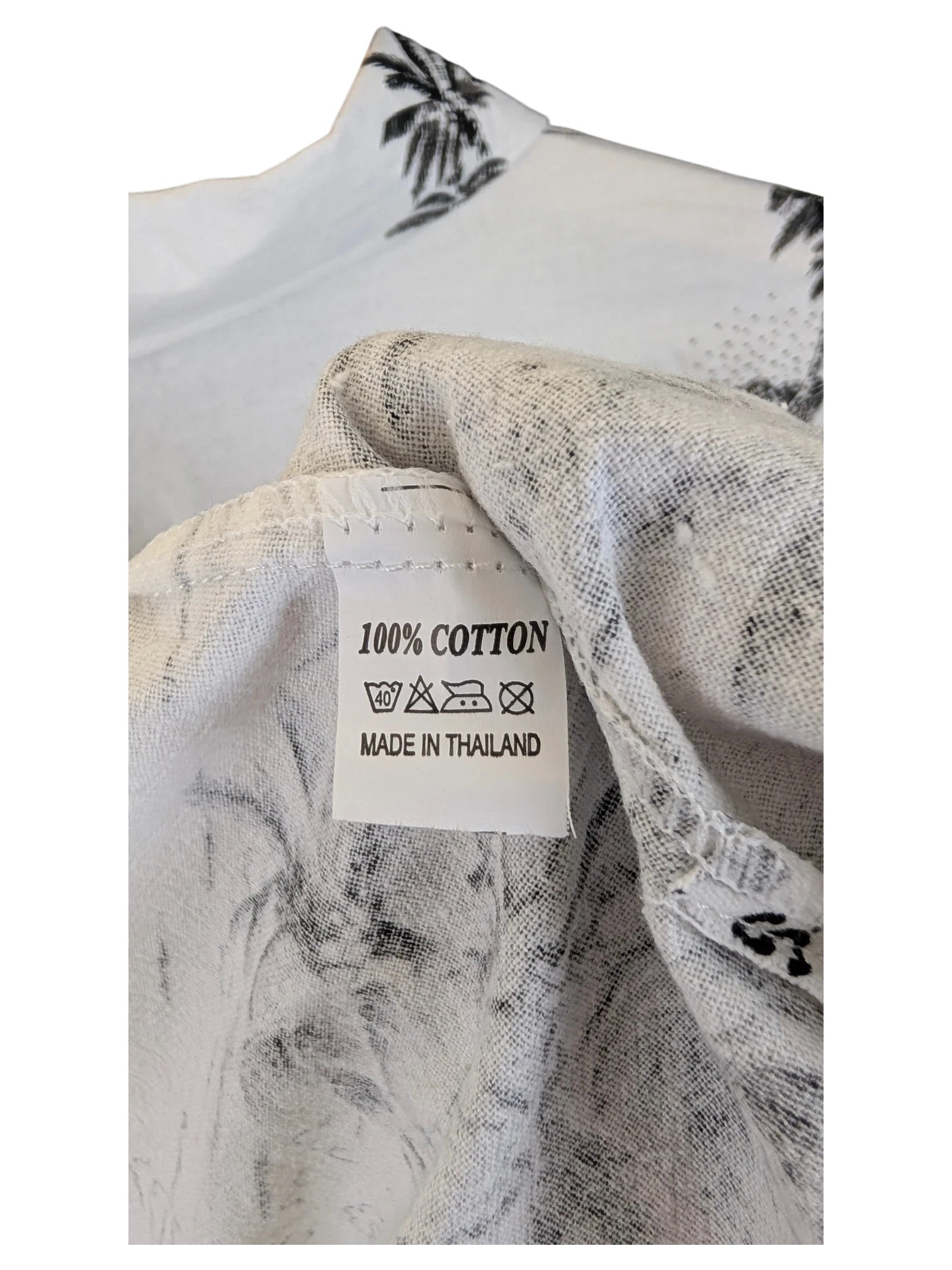 JAKE & IPI Shoreline Hawaiian shirt white cotton fabric with black palm tree print and care label