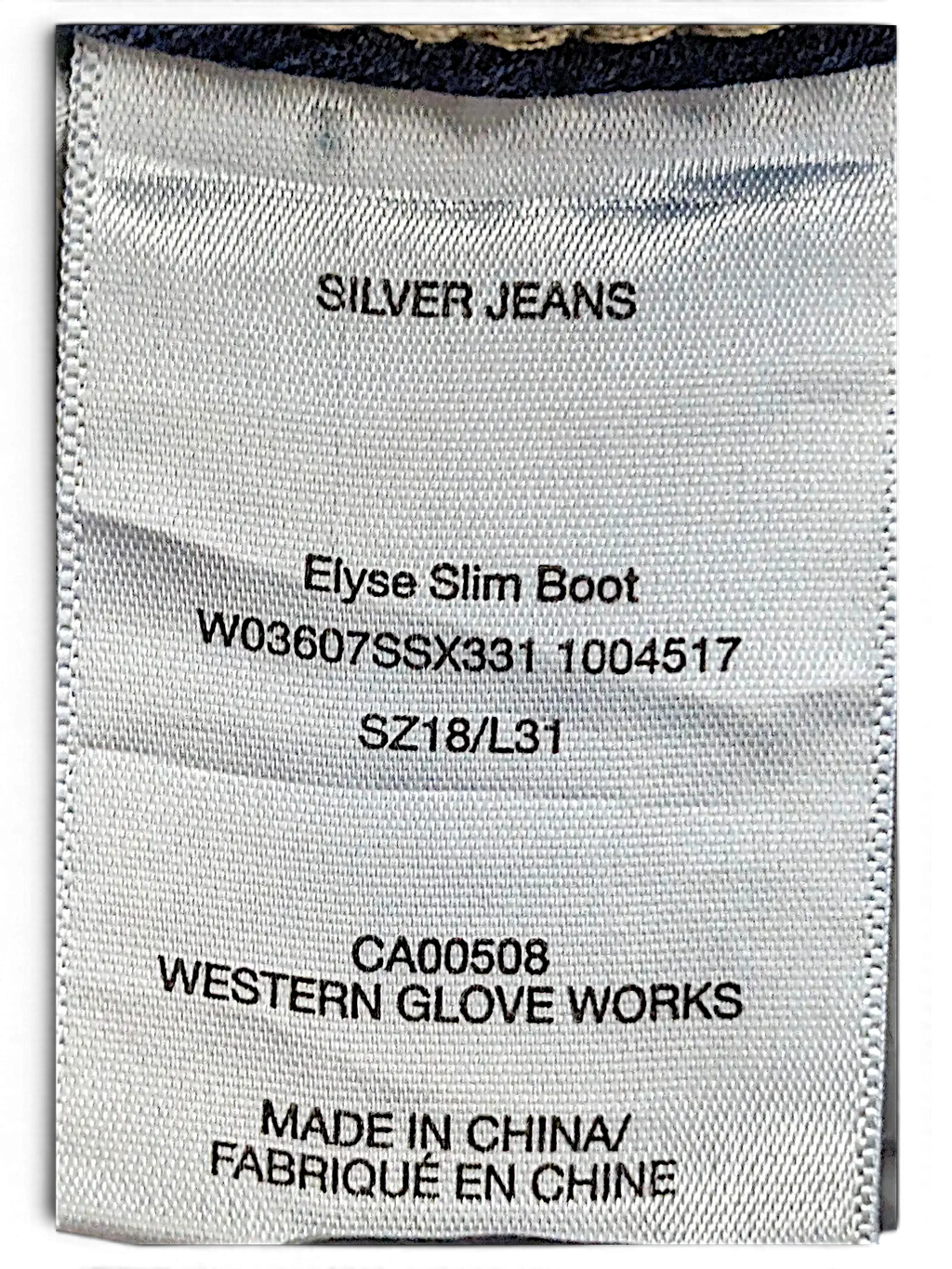 JAKE & IPI clothing tag for Silver Jeans Co. Elyse Slim Boot jeans, size 18 L31, made in China.