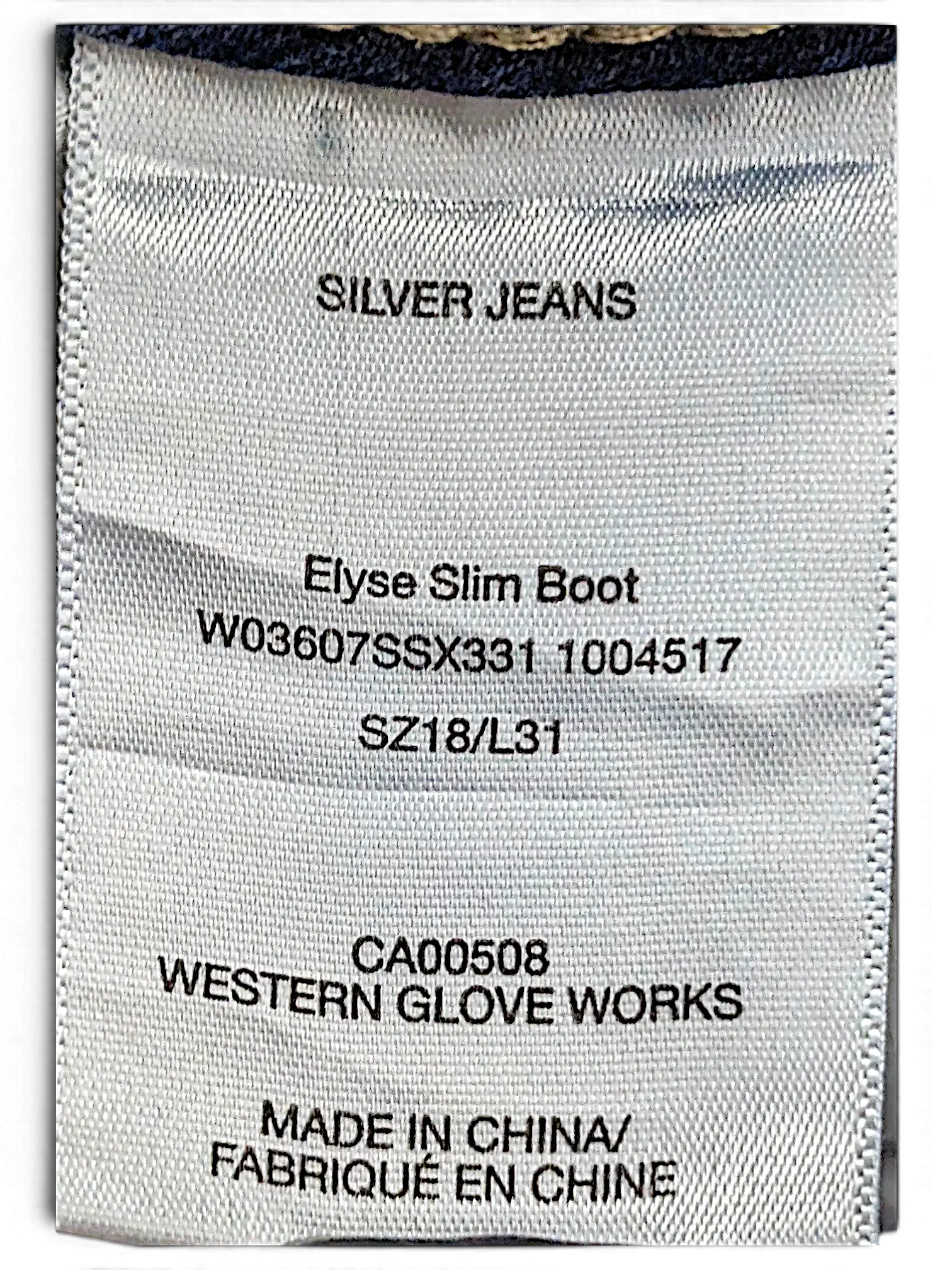 JAKE & IPI clothing tag for Silver Jeans Co. Elyse Slim Boot jeans, size 18 L31, made in China.