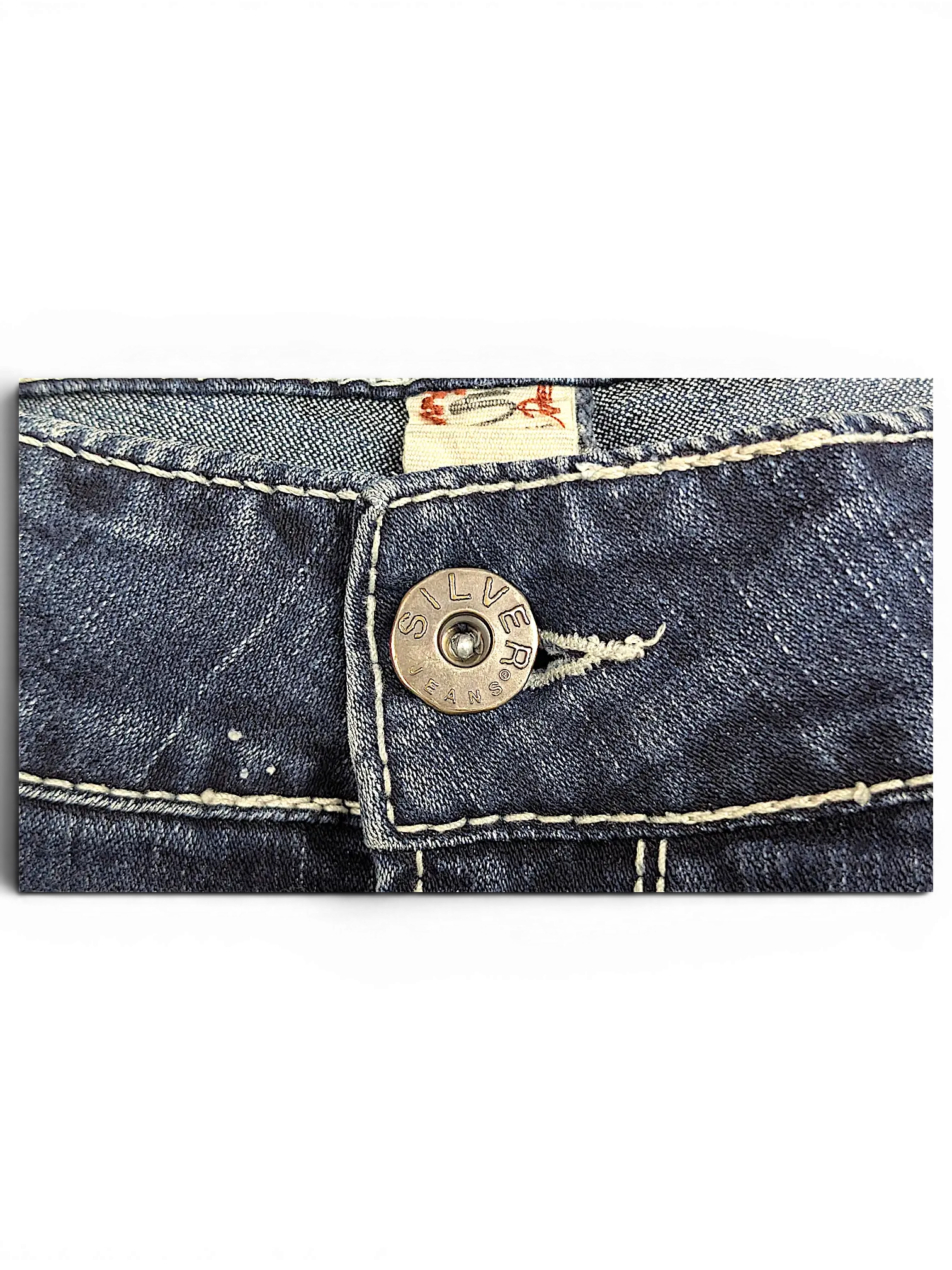JAKE & IPI Silver Jeans Suki capri denim shorts featuring a branded metal button and contrast stitching