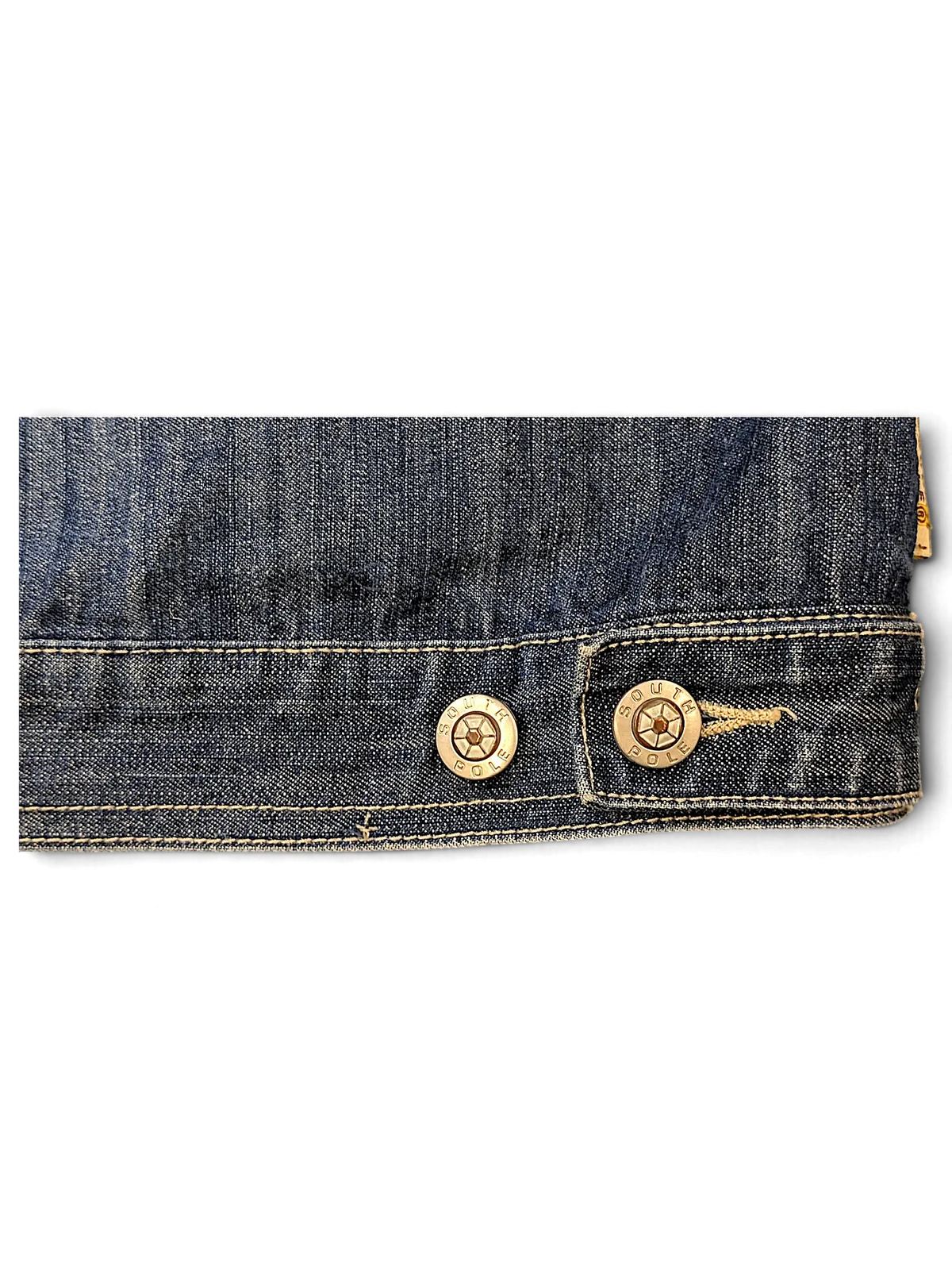 Close-up of JAKE & IPI Southpole denim jacket hem featuring branded metallic buttons and contrast stitching.