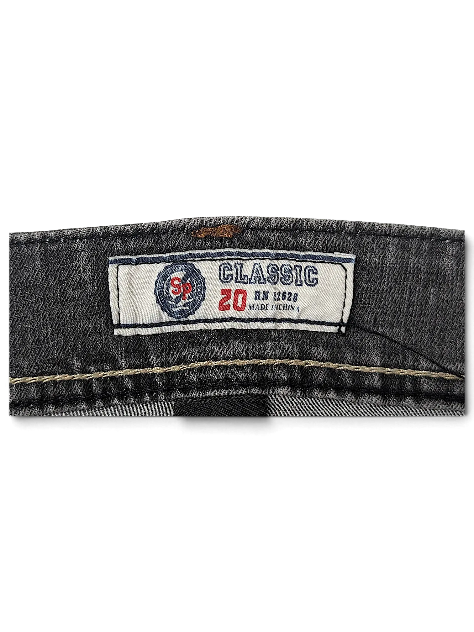JAKE & IPI SP Classic Y2K jeans interior label featuring size 20 and grey denim fabric texture.