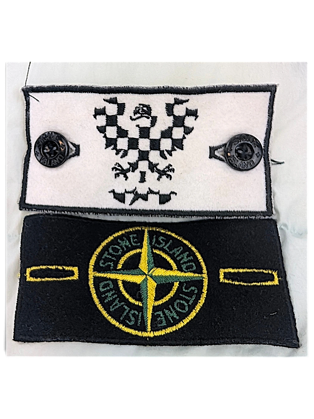 Stone Island compass sleeve patch and secondary badge supplied with the coat