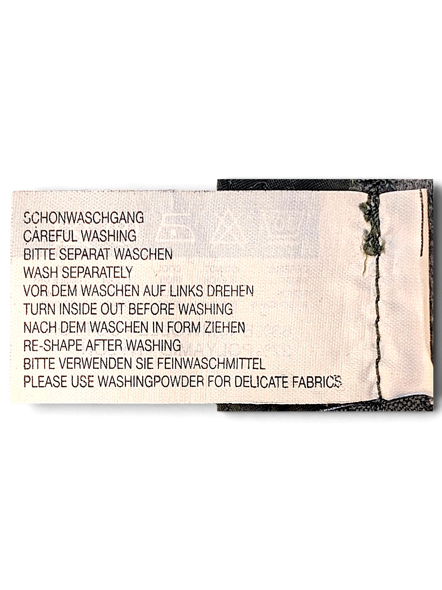 JAKE & IPI Street One Ricco joggers care label with washing instructions in German and English