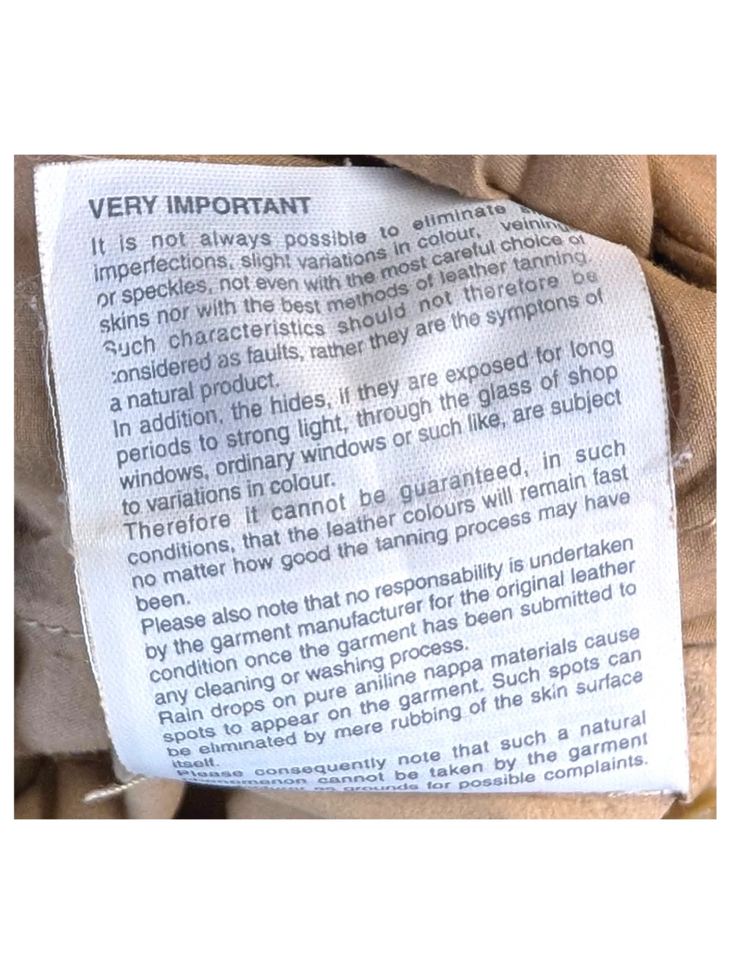 JAKE & IPI suede leather pants care instruction label inside beige garment