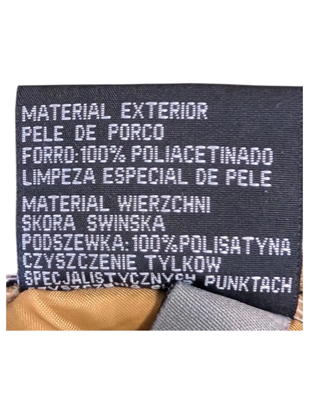 JAKE & IPI Enjoy Suede Leather Pants interior care label showing pigskin material and polyester lining details