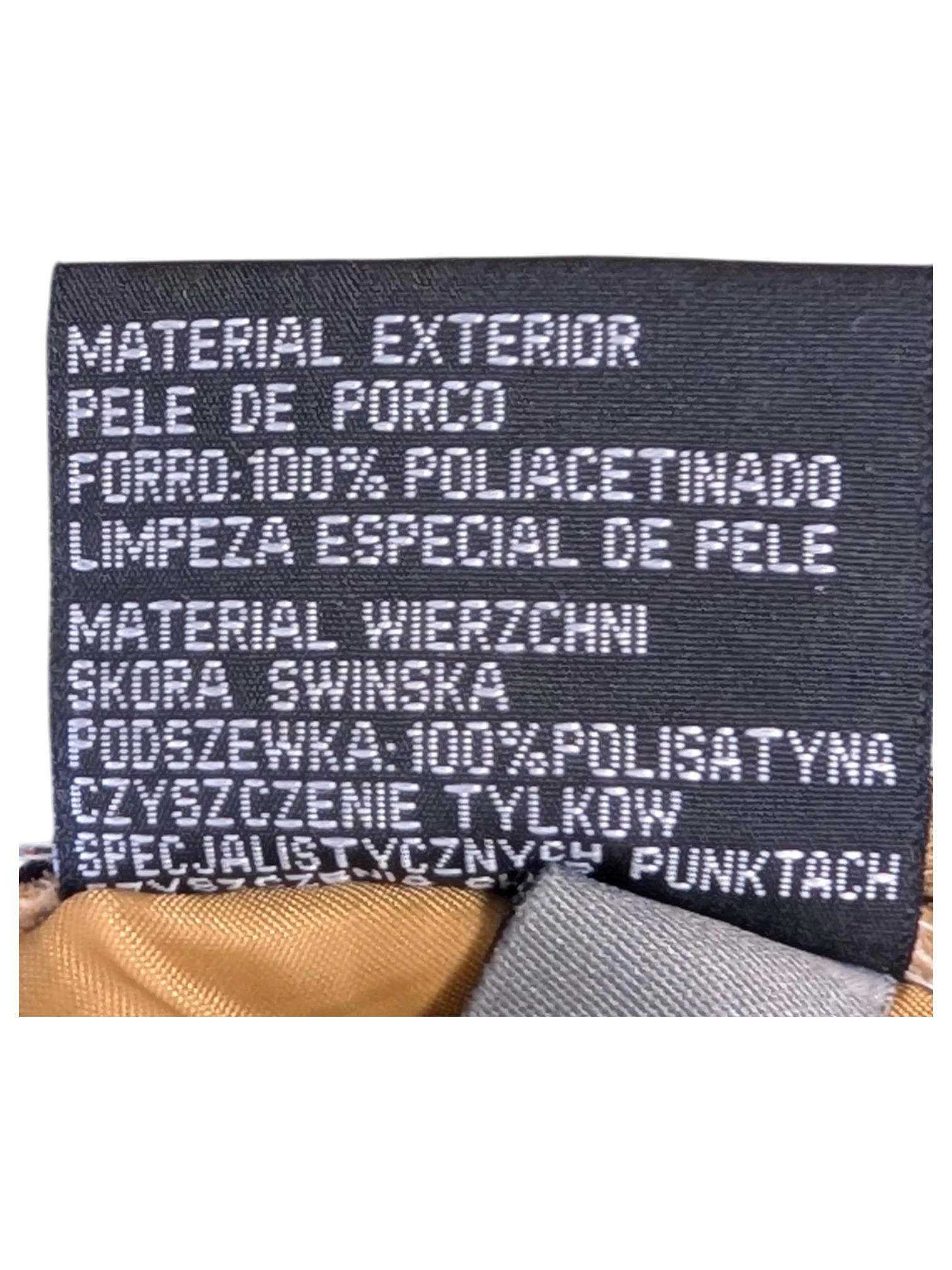JAKE & IPI Enjoy Suede Leather Pants interior care label showing pigskin material and polyester lining details