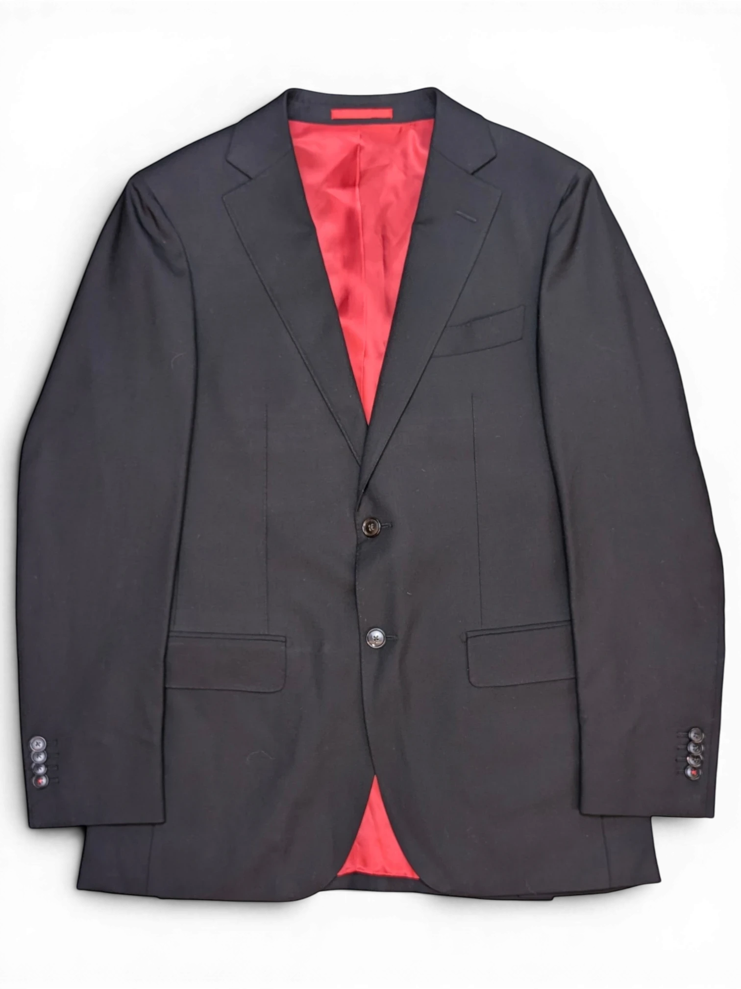 JAKE & IPI Suitsupply black suit jacket with a vibrant red silk lining and two-button front closure