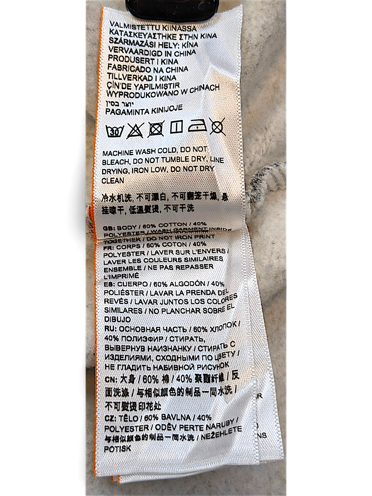 JAKE & IPI Superdry College garment care label showing 60 percent cotton and 40 percent polyester fabric composition
