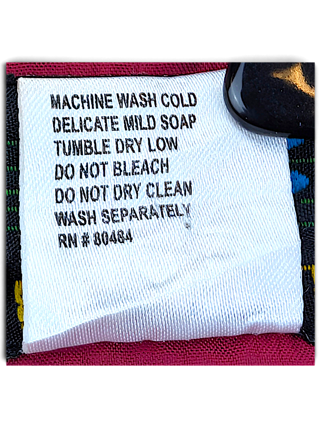 Active Elements Black and Red Stripe Windbreaker; Cold delicate wash and low tumble dry care label.
