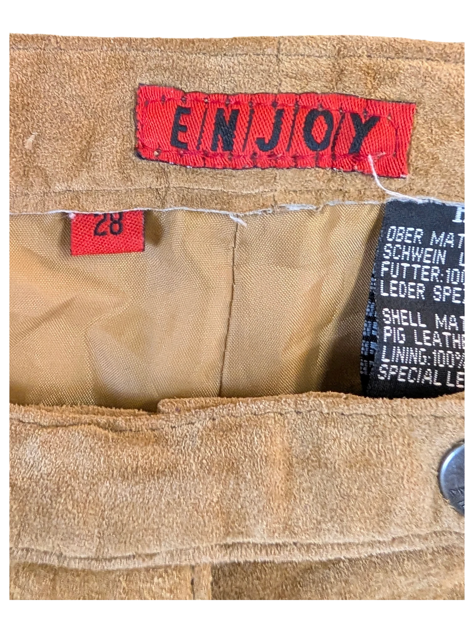 JAKE & IPI Enjoy tan suede leather pants interior label showing size 28 and pig leather material details