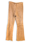 JAKE & IPI Mauritius tan suede leather pants with a straight leg fit and button closure hanging on a hanger.
