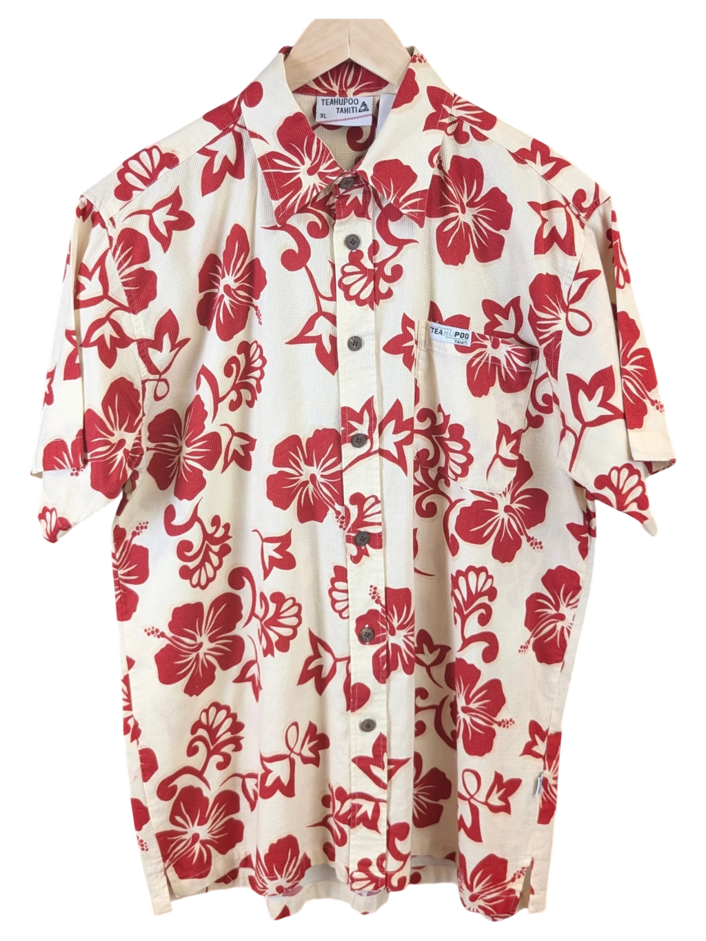 JAKE & IPI Teahupoo Tahiti short-sleeve Hawaiian shirt in cream with a red hibiscus floral print and button-down front.