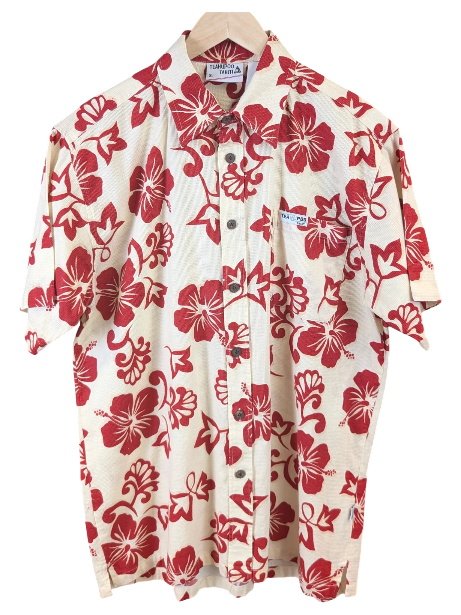 JAKE & IPI Teahupoo Tahiti short-sleeve Hawaiian shirt in cream with a red hibiscus floral print and button-down front.