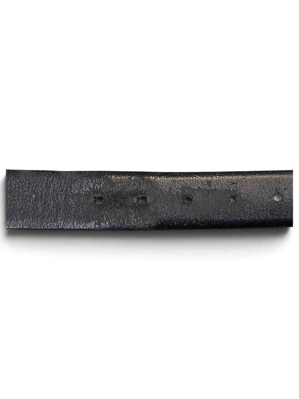 Close-up of a black leather Tommy Hilfiger belt featuring a textured finish and punched adjustment holes by JAKE & IPI