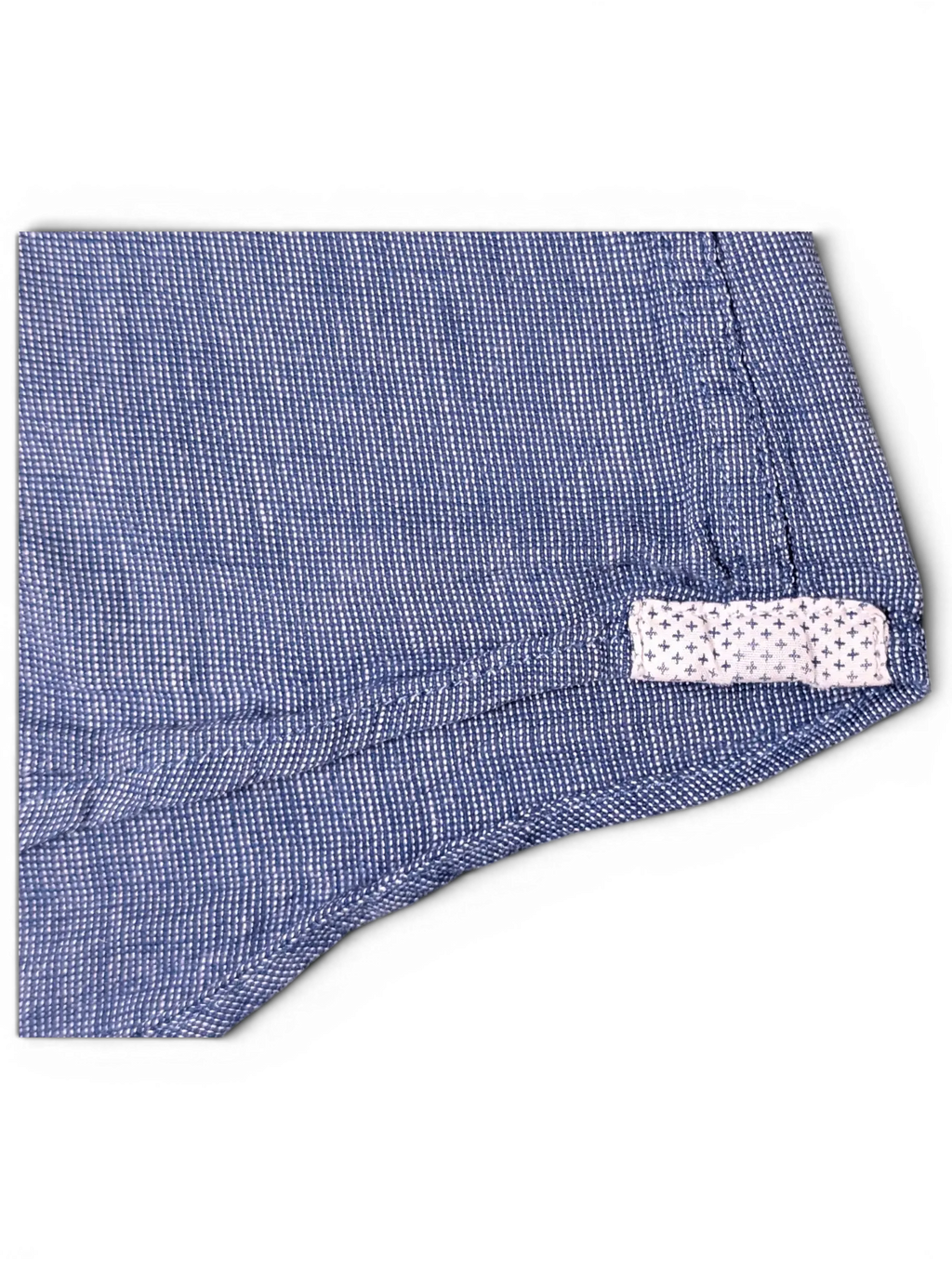 JAKE & IPI Tommy Hilfiger blue button-up shirt featuring a textured fabric and a small patterned hem detail.