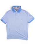JAKE & IPI pre-owned light blue Tommy Hilfiger polo shirt with embroidered flag logo and patterned collar lining.