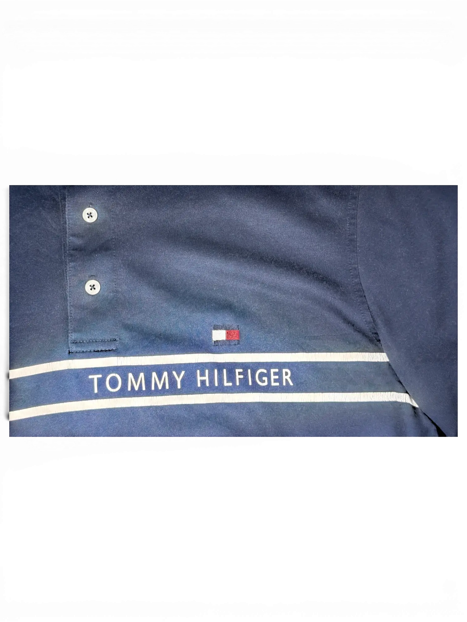 JAKE & IPI pre-owned navy Tommy Hilfiger polo shirt with white piping, wordmark, and flag logo detail.