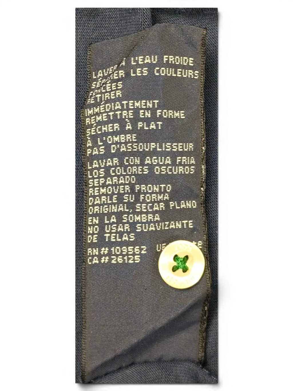 JAKE & IPI Tommy Hilfiger navy polo shirt care label with washing instructions and spare button