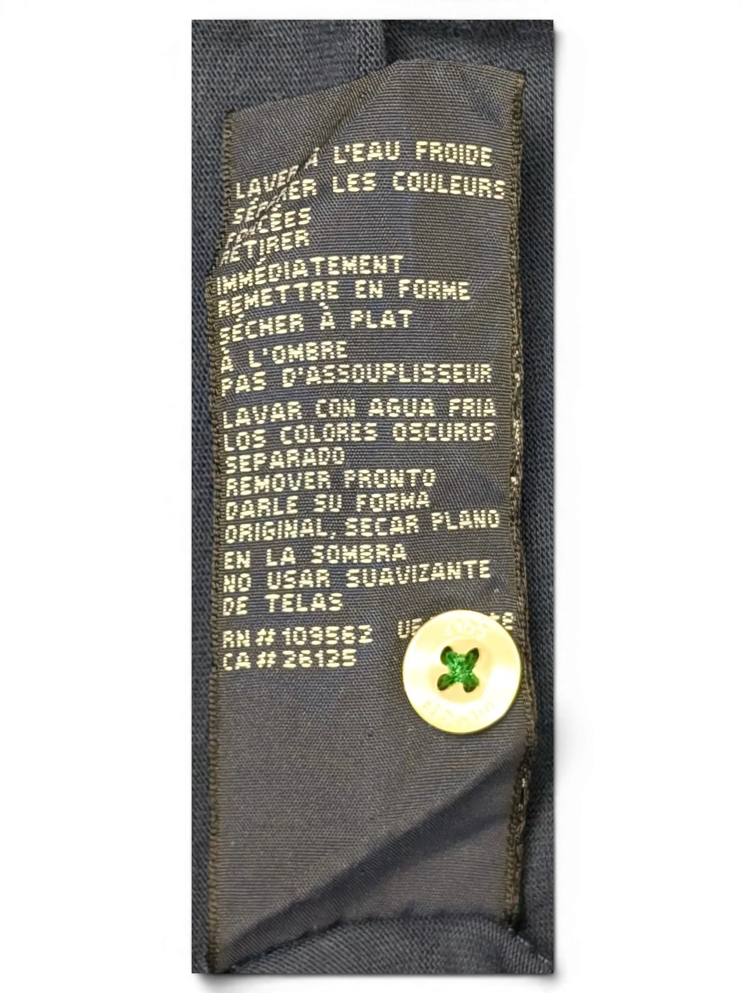 JAKE & IPI Tommy Hilfiger navy polo shirt care label with washing instructions and spare button