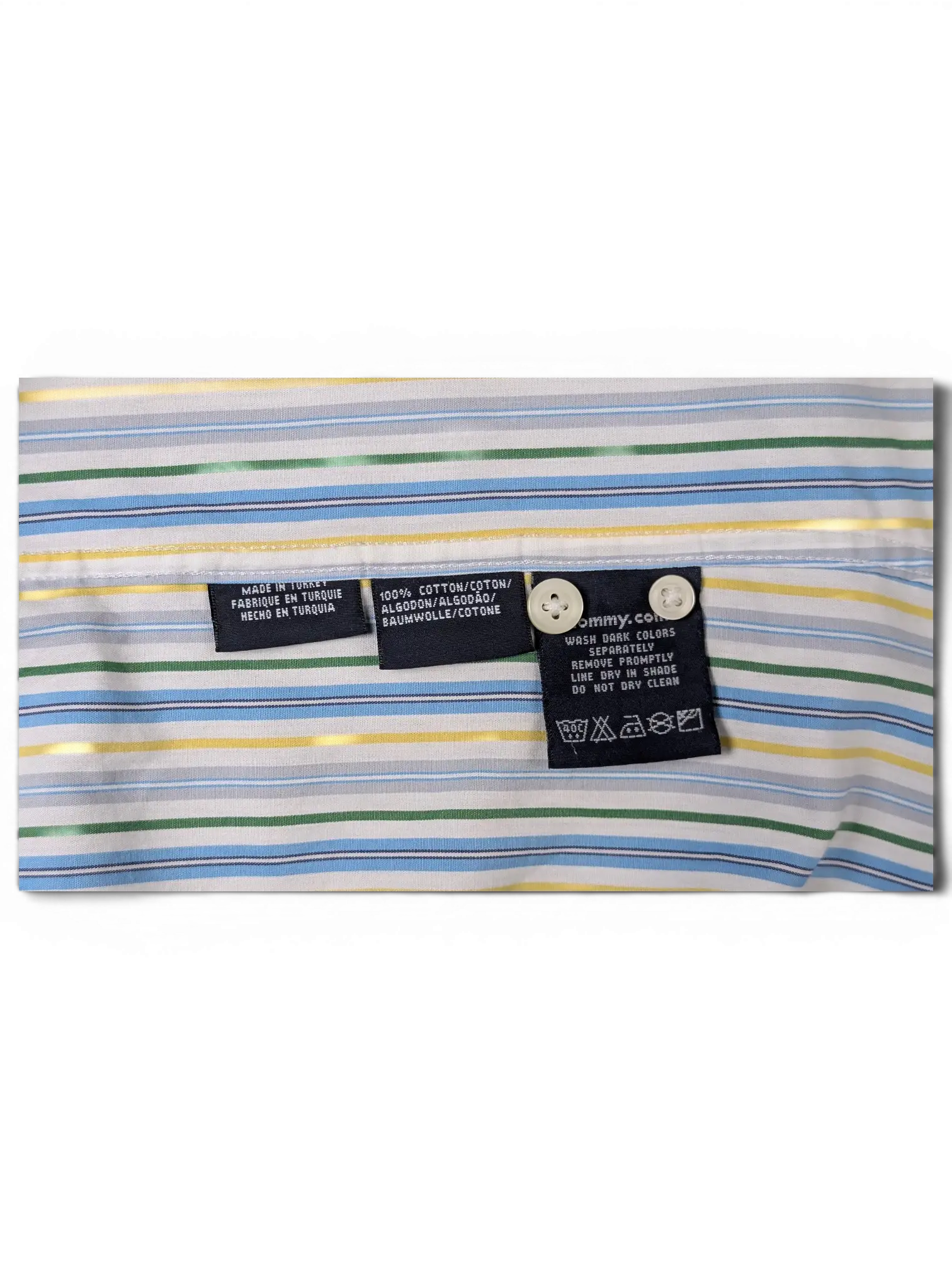 JAKE & IPI Tommy Hilfiger shirt interior labels showing 100% cotton material and care instructions on striped fabric