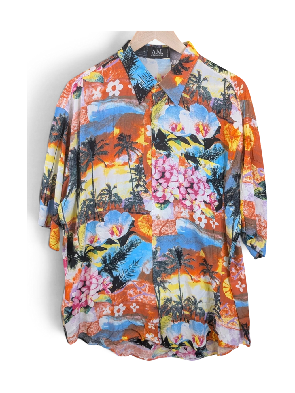 JAKE & IPI A.M. & Company short-sleeve Hawaiian shirt featuring a vibrant tropical sunset, palm tree, and floral print.