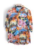 JAKE & IPI A.M. & Company short-sleeve Hawaiian shirt featuring a vibrant tropical sunset, palm tree, and floral print.