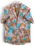 JAKE & IPI Hawaiian shirt featuring a tropical palm leaf and hibiscus floral print in turquoise and tan tones.