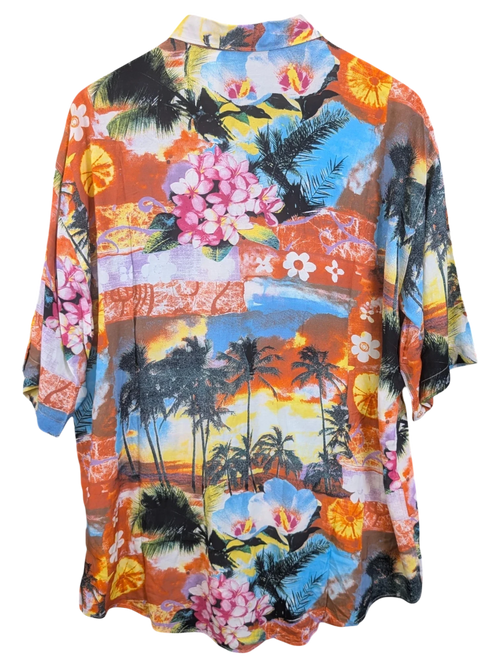 JAKE & IPI Hawaiian shirt featuring a vibrant tropical sunset print with palm trees and hibiscus flowers