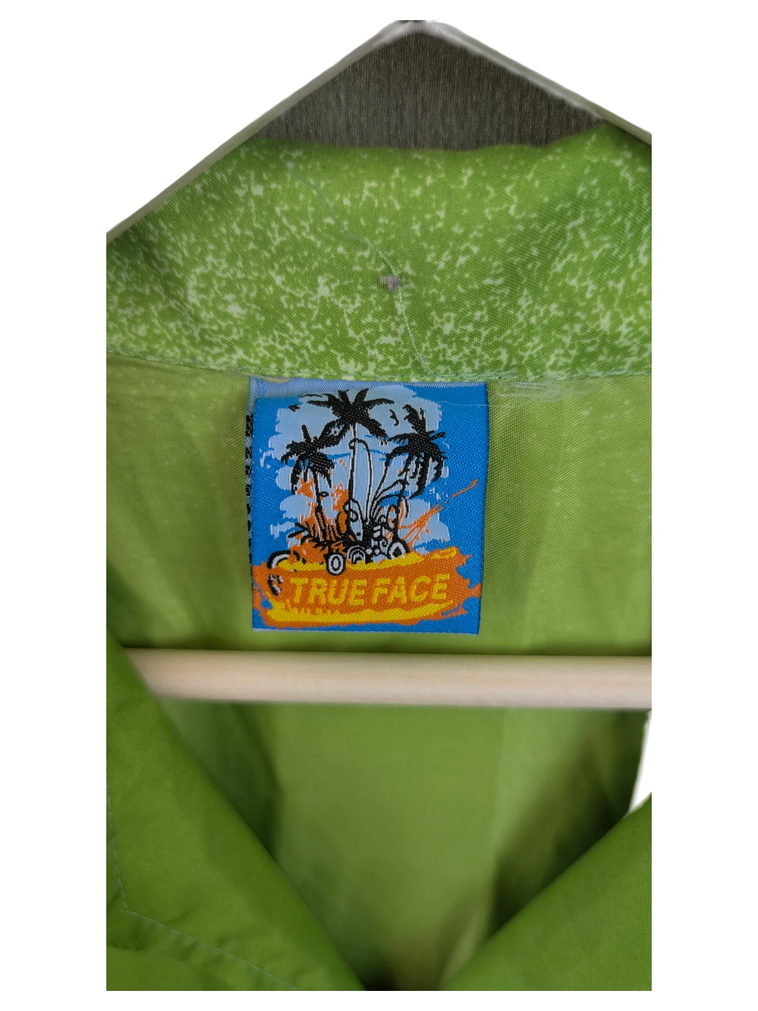 JAKE & IPI True Face Hawaiian shirt featuring a lime green fabric and a vibrant blue tropical brand neck label