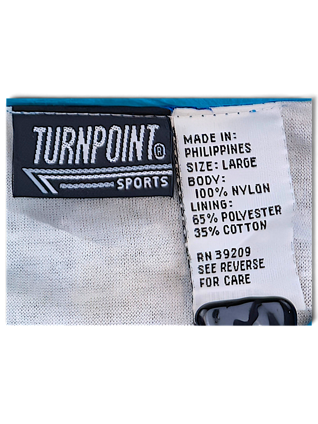 Turnpoint Sports Blue Chevron Windbreaker; Turnpoint Sports label, size Large and shell and lining composition.