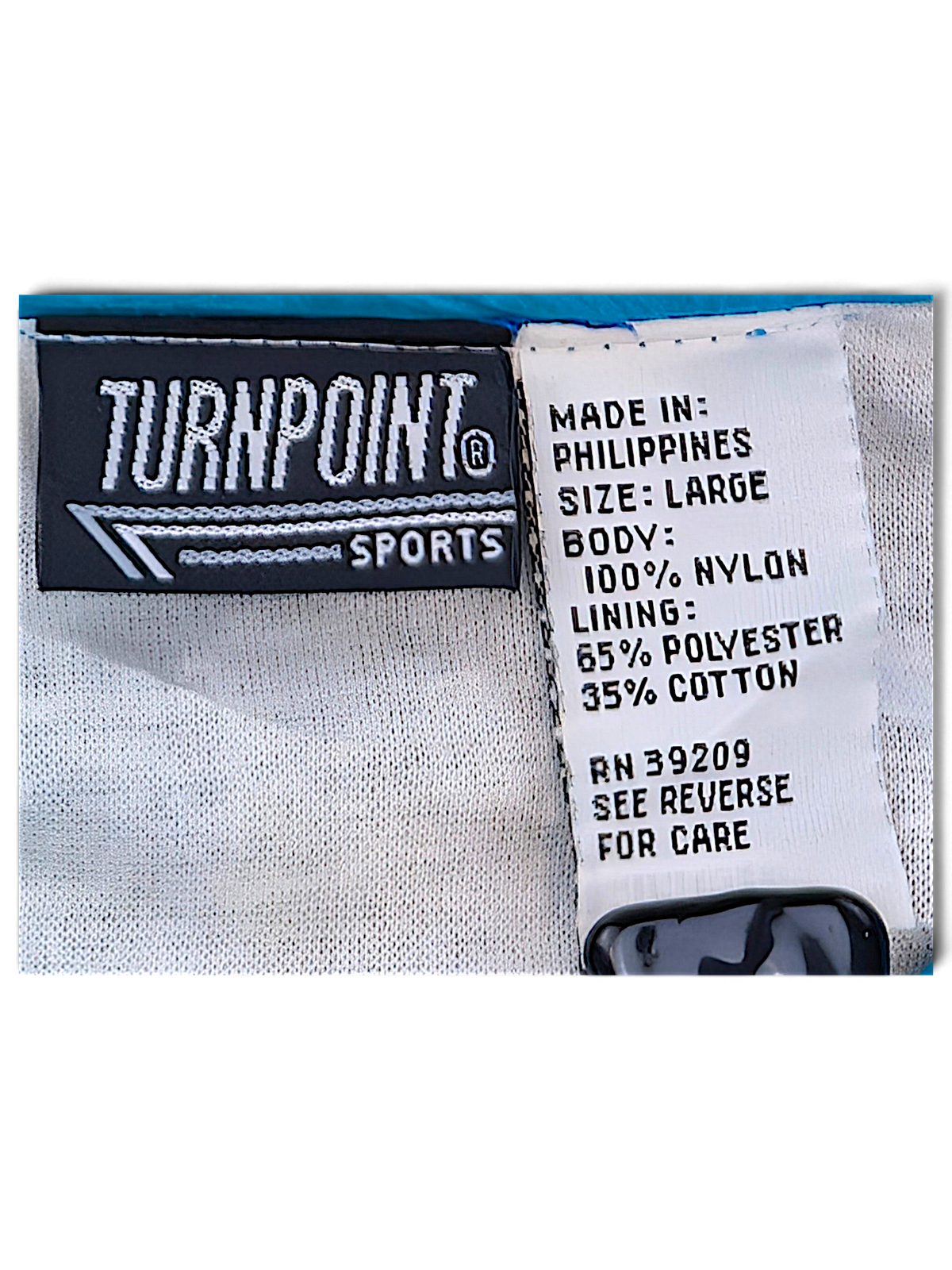 Turnpoint Sports Blue Chevron Windbreaker; Turnpoint Sports label, size Large and shell and lining composition.