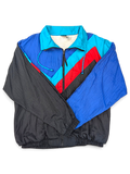 Turnpoint Sports Blue Chevron Windbreaker; Front view with blue, black, turquoise and red chevron panels.