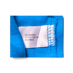 JAKE & IPI turkoosin U.S. Polo Assn. -paidan sisälappu malli- ja valmistustietoineen