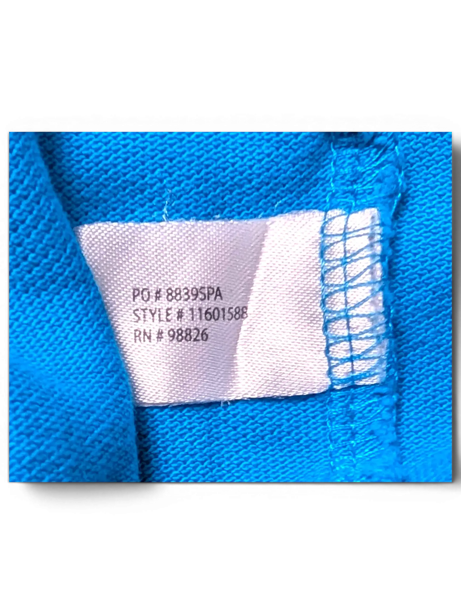 JAKE & IPI turquoise U.S. Polo Assn. shirt interior fabric tag showing style and manufacturing details